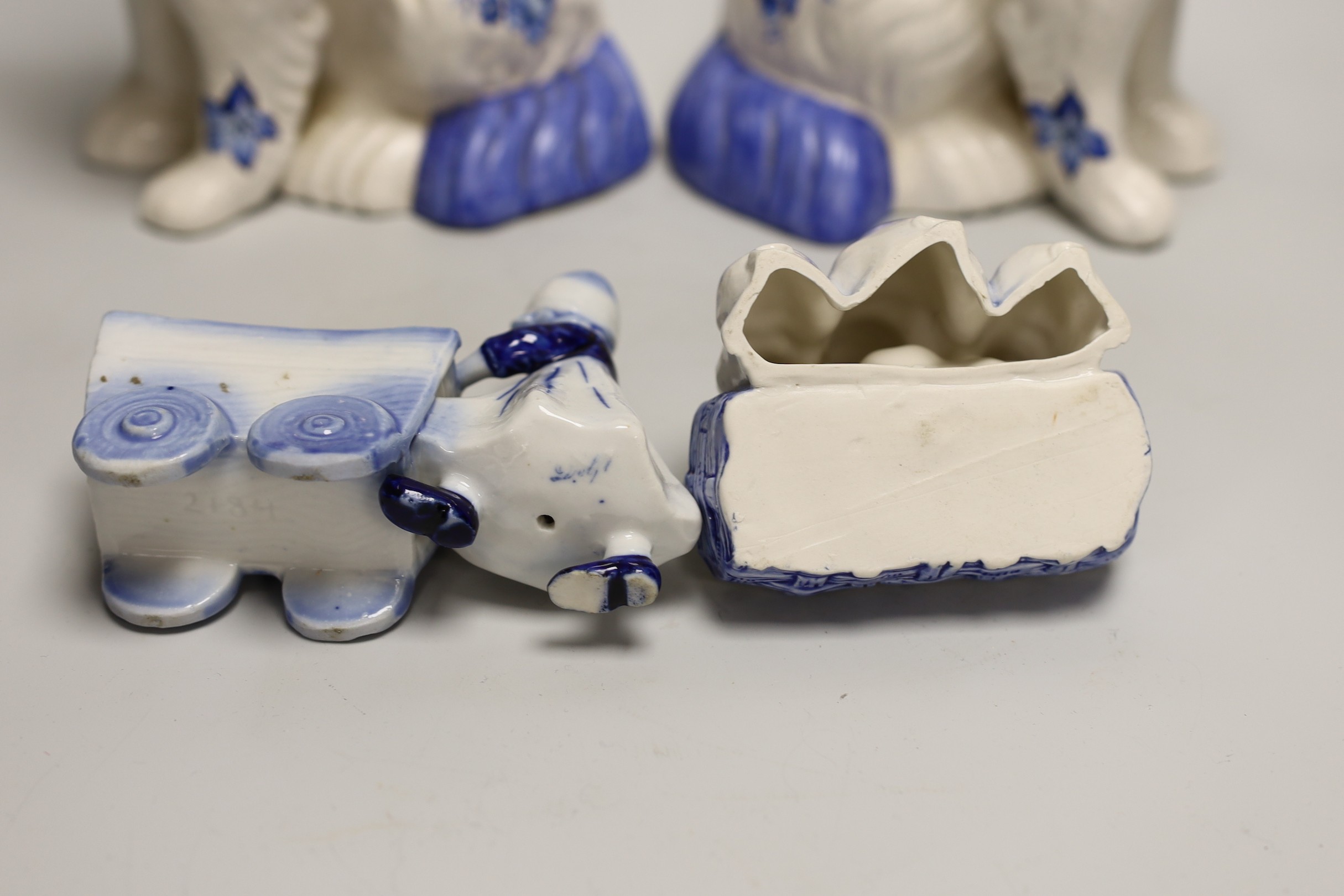 A pair of Staffordshire style comforter spaniels and two other items